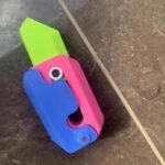 3D Printed Gravity Jumping Radish Toy – Mini Decompression Fidget Pendant - Image 2